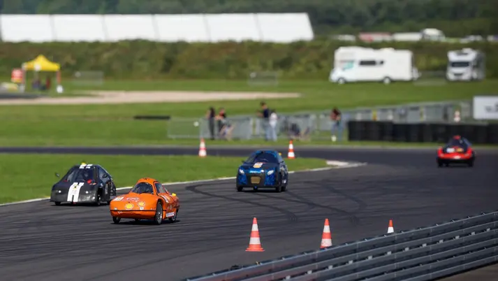 Hydrogen city cars racing on track with Nanotec motors leading at the Shell Eco-Marathon competition.